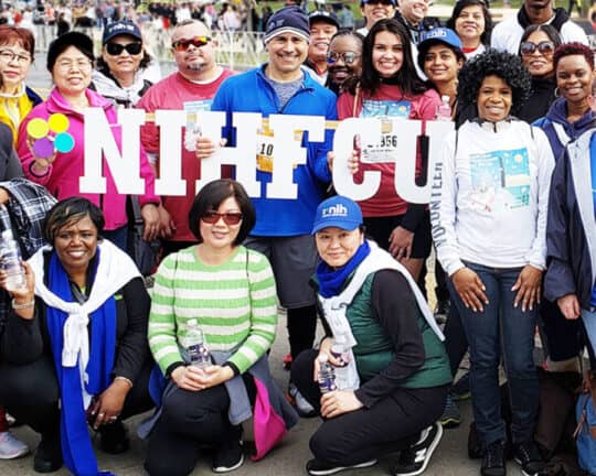 NIHFCU team posing at event