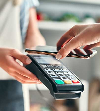 NIHFCU Member Paying At Register with Mobile Phone  