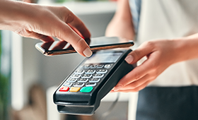 NIHFCU Member Paying At Register with Mobile Phone  