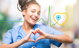 Happy Nurse member forming a heart with her hands