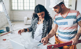 Homeowners working on home repairs furnished by a NIHFCU Home Equity Loan